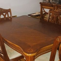 Tommy Bahama Dining Room Table And Four Chairs  , In Excellent Condition, Seat Cushions Excellent Condition No Stains , Suede Leather Seats