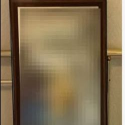 Federal Style Framed Mirror Mirror in a wood frame with an eagle on top. 18.5x31”