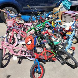 14 KIDS BIKES (don't know if they hold air,  didn't check) MAKE ME AN OFFER