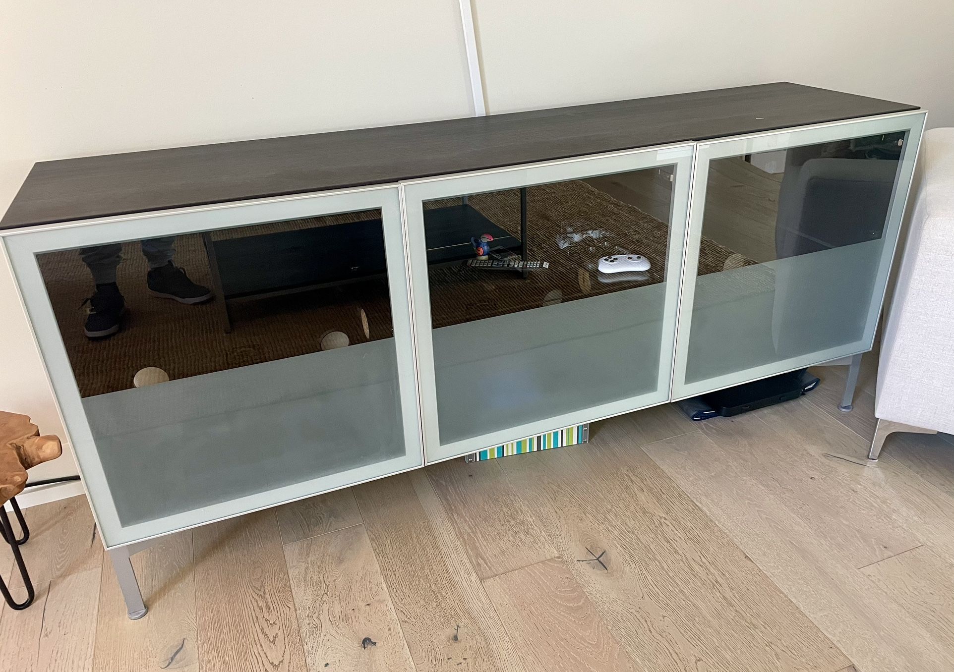 Console with glass doors in fair condition as is pick up only. 75.5x19.5 x 33