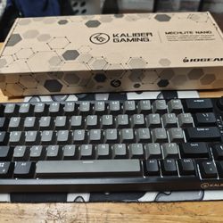 Black and Gray gaming keyboard with knob