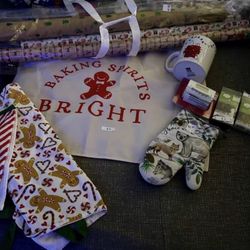 Variety of Christmas items- Lights, gift wrapping paper, adult aprons