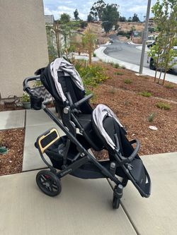 UPPAbaby two seater stroller with skate board and bassinet