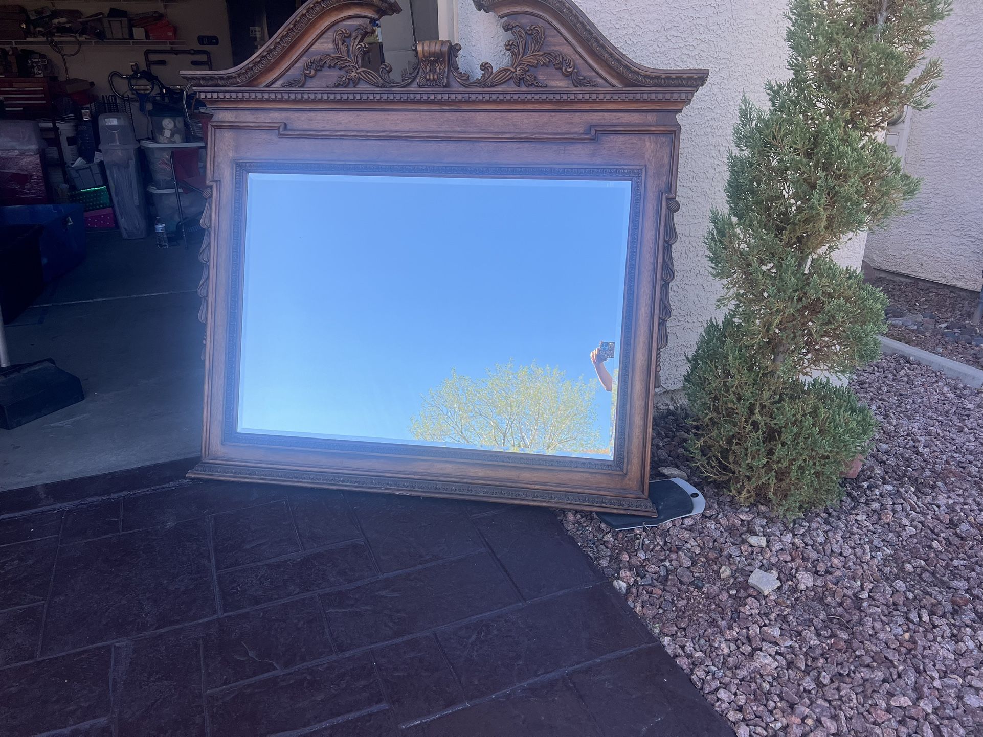 A Beautiful Beveled Mirror/carved on top