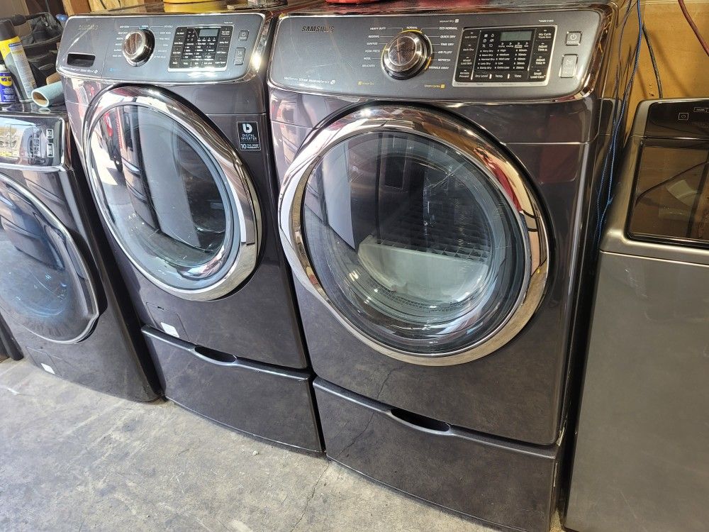 Samsung Front Loading Washer And Stackable Gas Dryer Set With Pedestals 