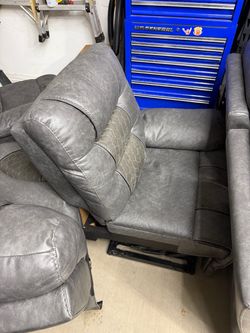 Grey leather power reclining couch. Throw an offer would like to get rid of today