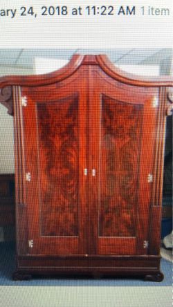 Gorgeous antique flame mahogany front armoire
