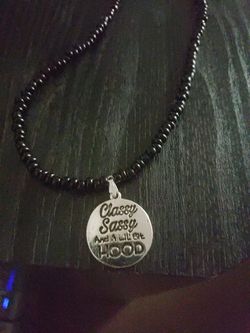 Black necklace with silver pendant
