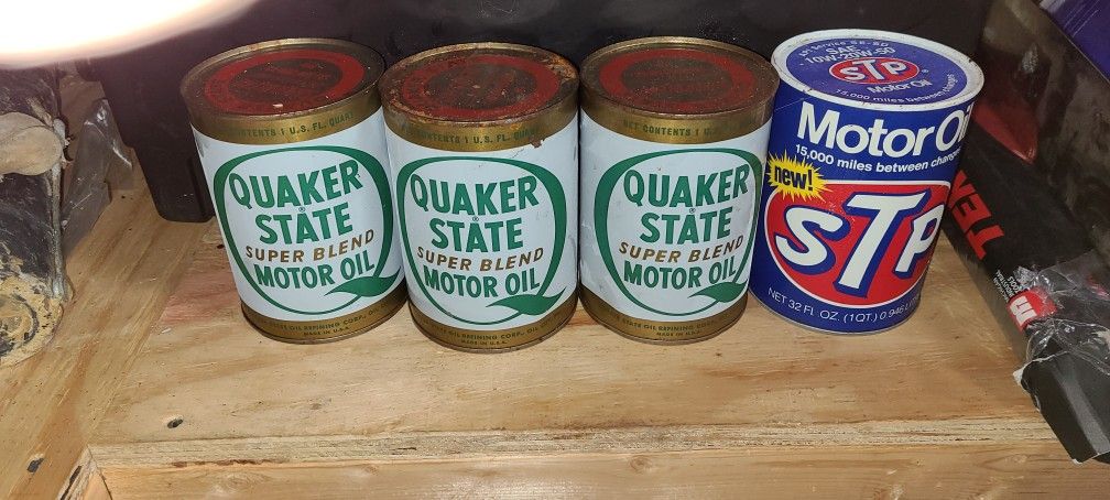 4 Full Oil Cans. Good Condition