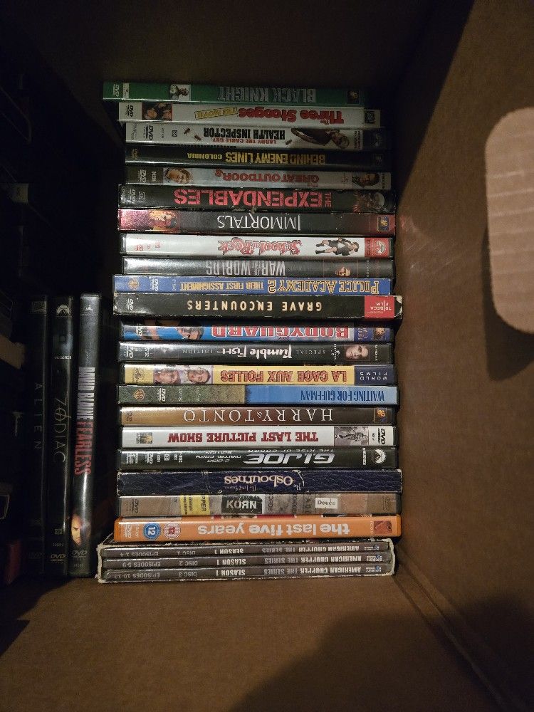 Container Full Of Dvds and Blu Ray Player