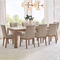 Anna Maria Dining Table and 8 Chairs  Retail $2000, our price $1190  Like new condition, floor model, no issues at all