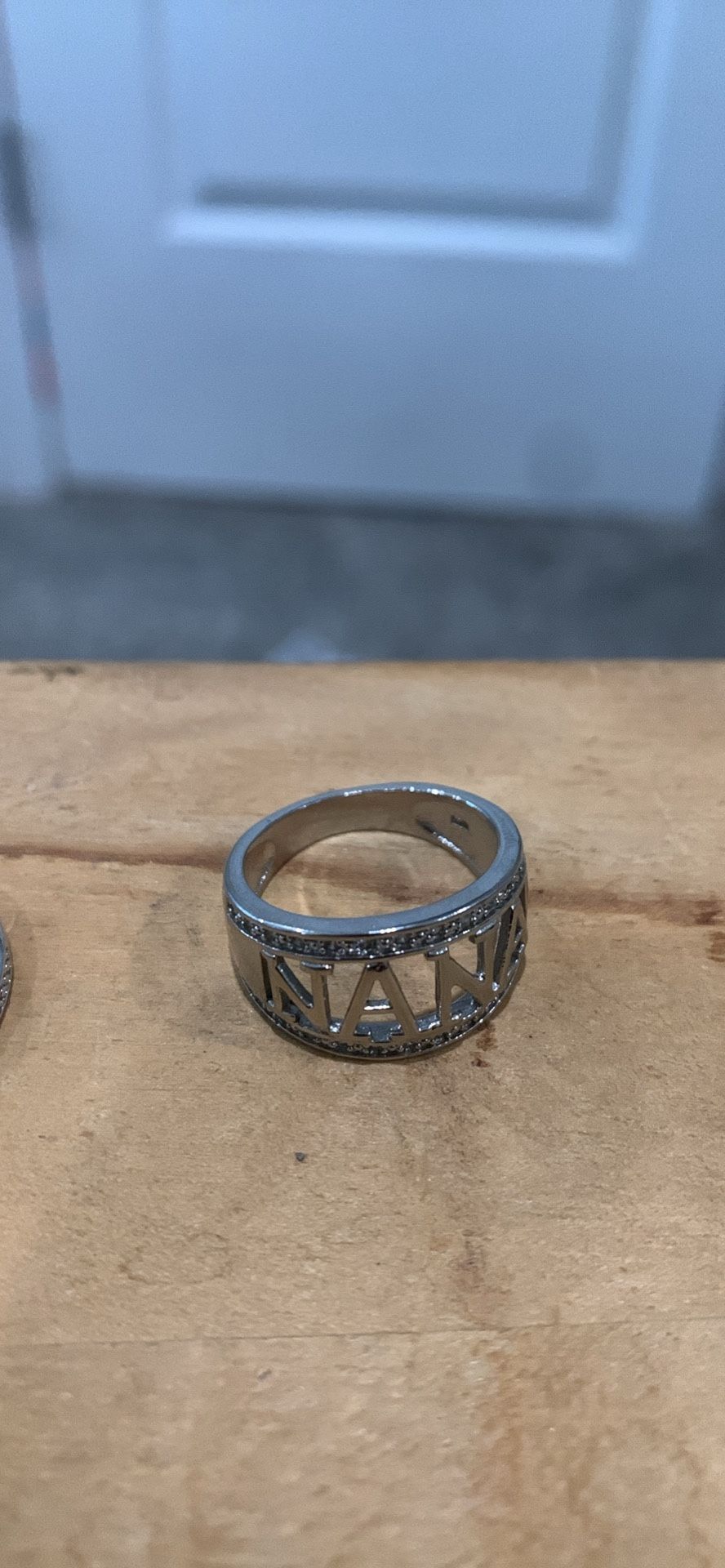 N A N A WIDE BAND SILVER RING
