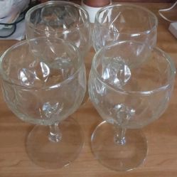 four vintage wine glasses from the 1940s with a clear diamond quilt pattern.