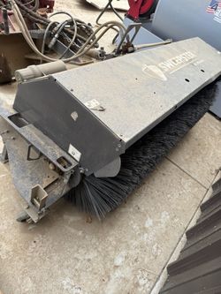 Skid steer sweepers