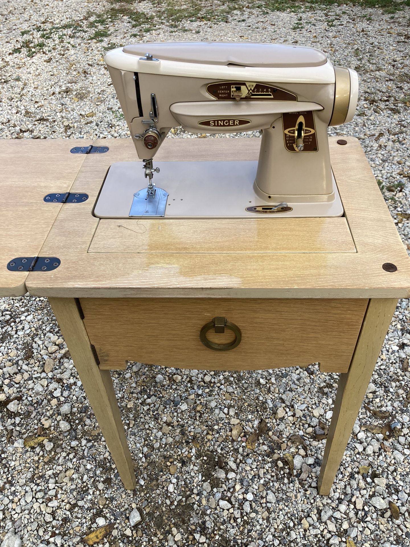 Singer Model 503a flip-top sewing machine with knee activation