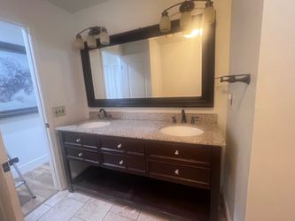 72” Double sink bathroom vanity with granite top and large mirror .