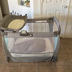 Baby Bouncer And A Playpen/Bed Clothes With A Diaper Changing Stand
