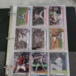 172 assorted baseball cards in black 3 ring binder