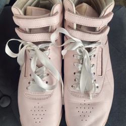 Woman’s Hightop Reeboks athletic shoes