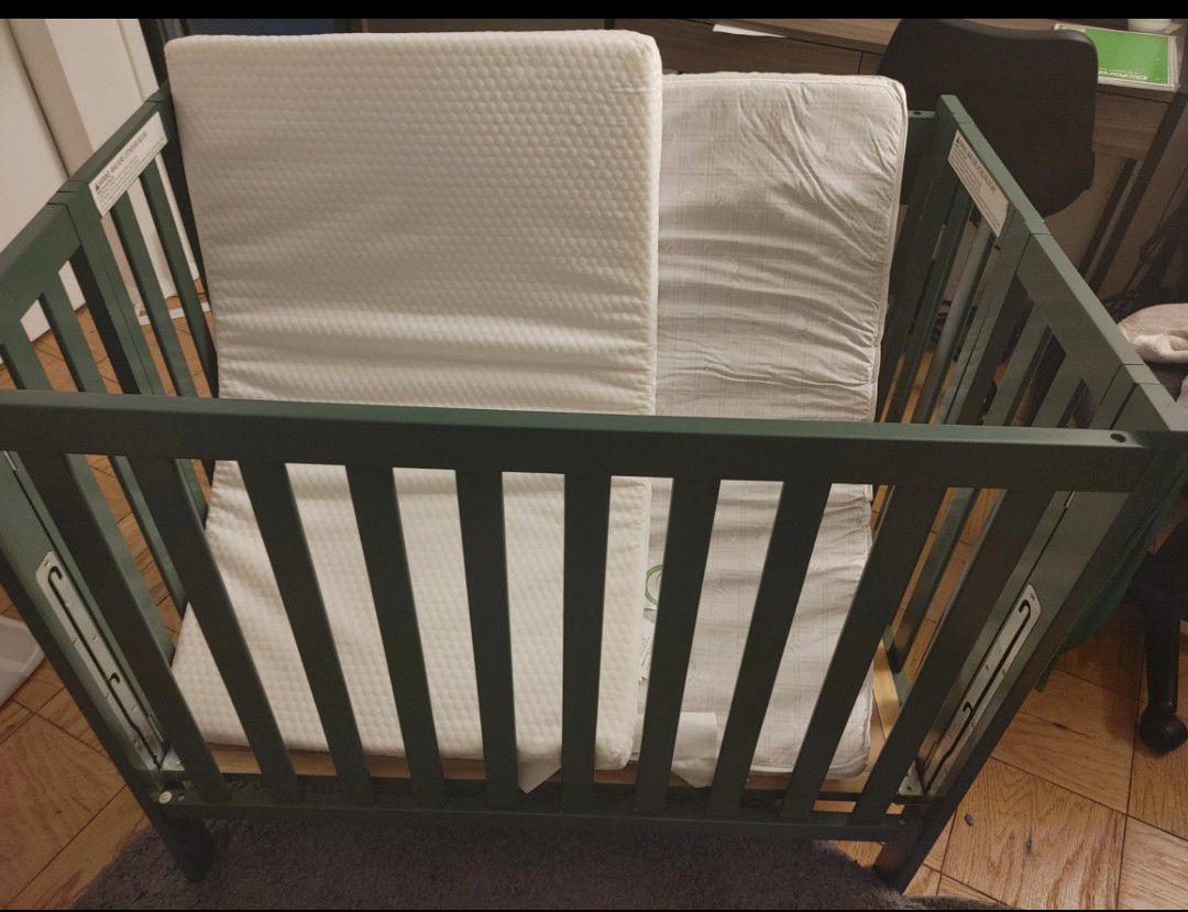 Gently Used Mini Crib With 2 Mattresses 