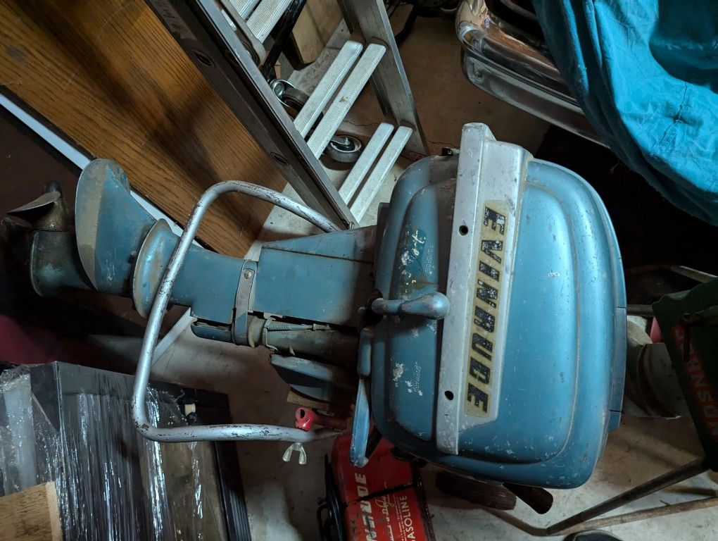 Two Outboard Motors Johnson And An Evinrude