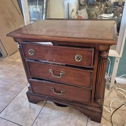 style wood nightstand or side table, often found in sets with dressers and beds.