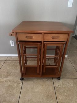3-Piece set space saver drop leaf dinning set with wheels . Compact storage drawer and 2 stools . It’s available as long as you can see this post. Win