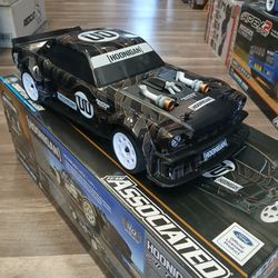 Team associated kan block RC Street passing car.