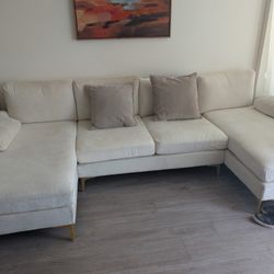 Soft sueded cream colored couch 