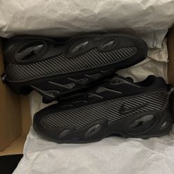 nike nocta glide triple black