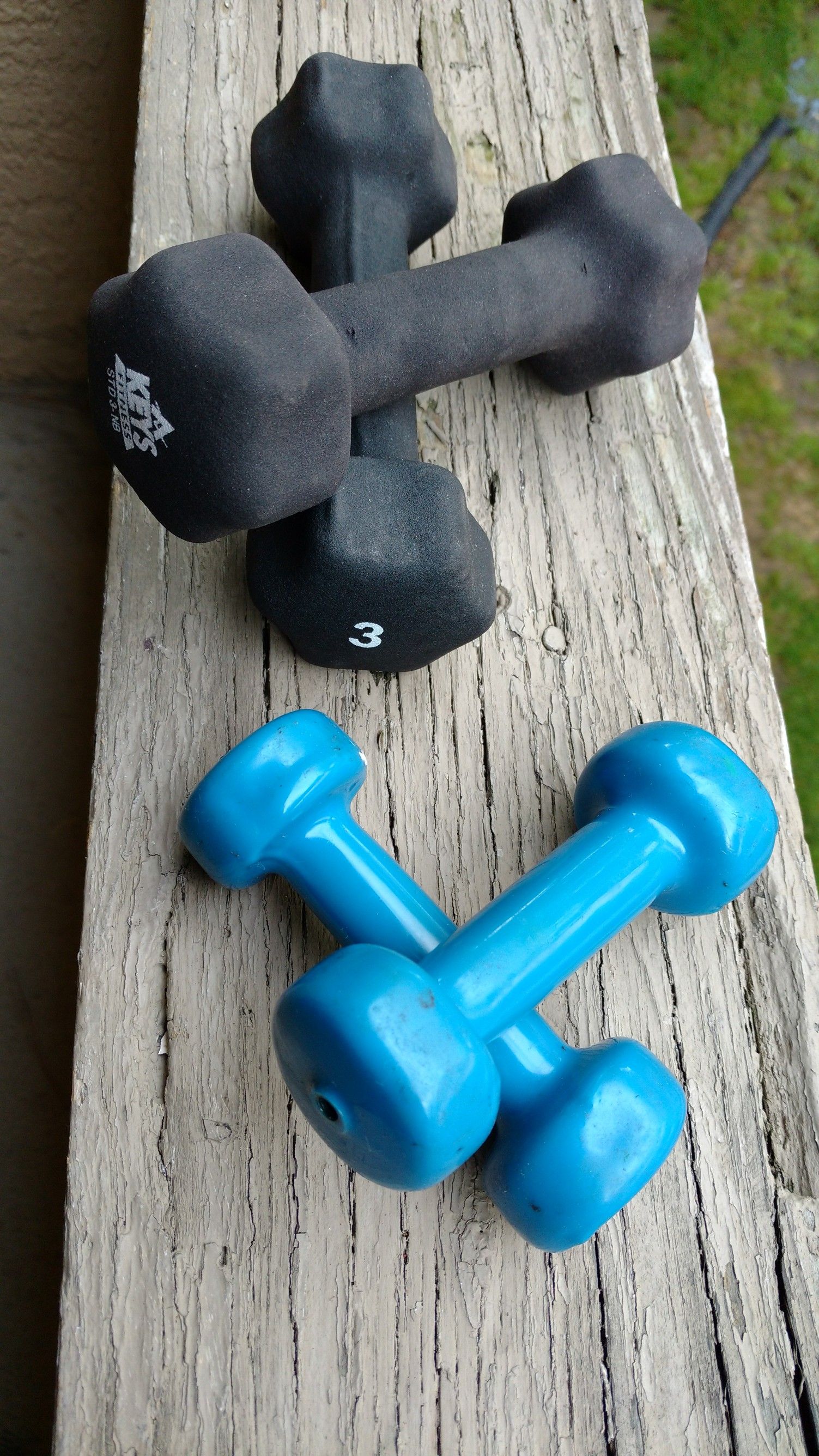 Set of four black and blue 3 pound and 1 lb dumbbell set