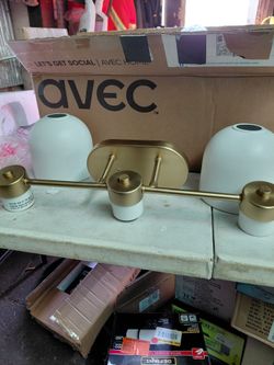 Progress Lighting 22" 3 light bathroom vanity light fixture in brushed gold with white metal shades