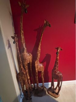 Hand craved giraffes from https://offerup.com/redirect/?o=Uy5BZnJpY2E=