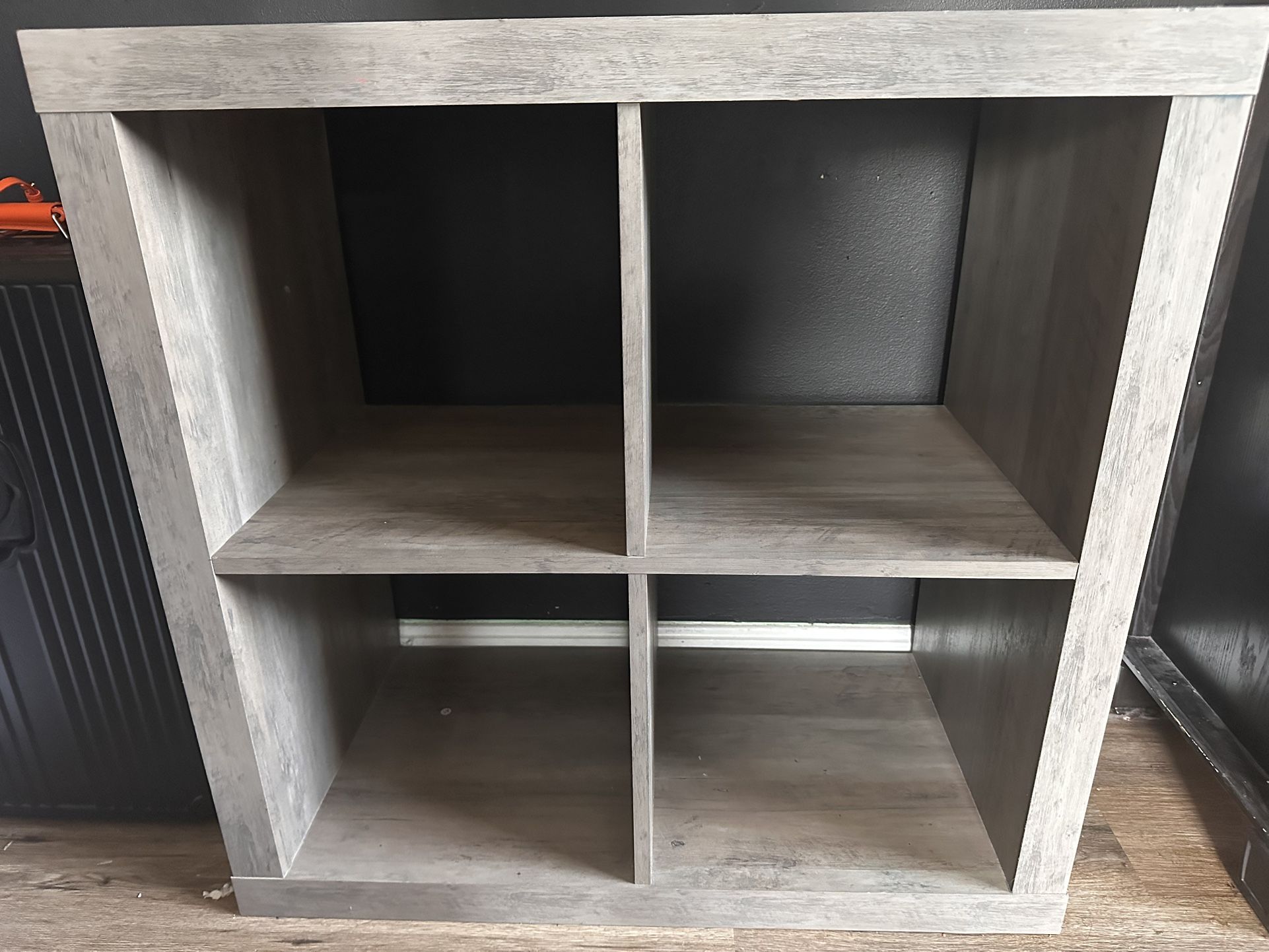 used- like new TV stand with 4 spaces for storage boxes!