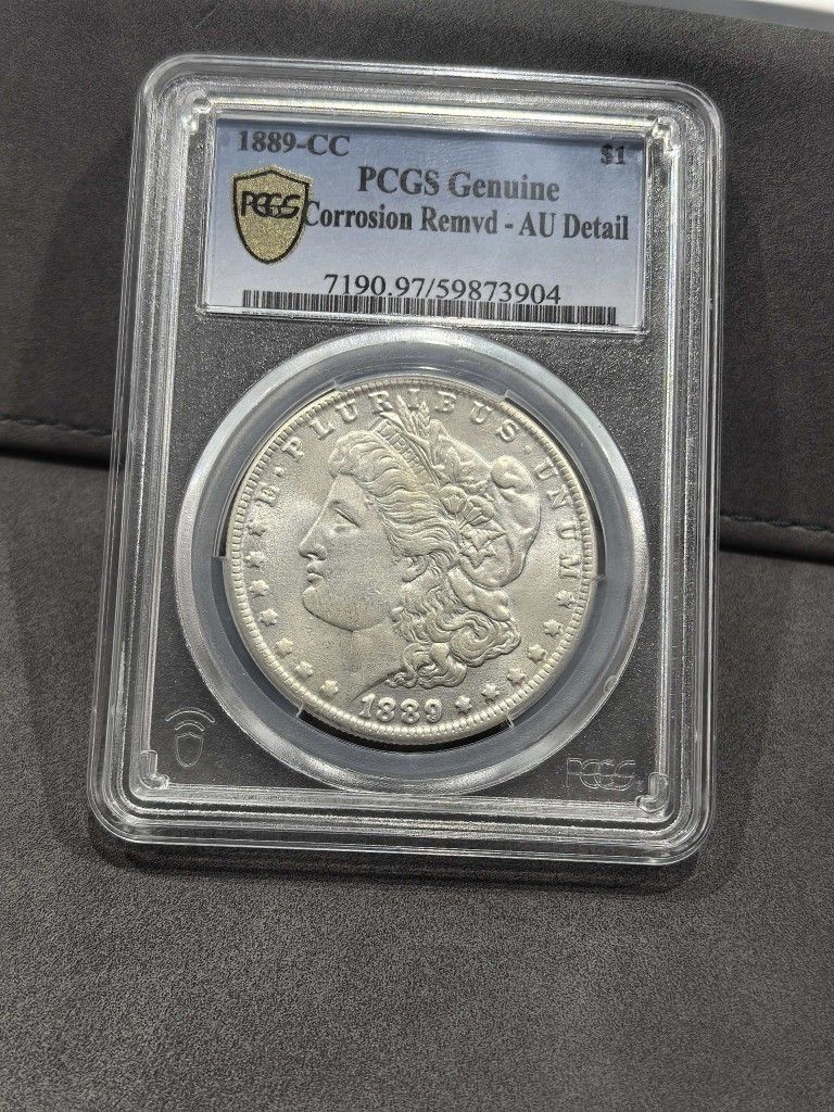 1889-CC Morgan Silver Dollar PCGS Genuine Corrosion Remvd AU Detail