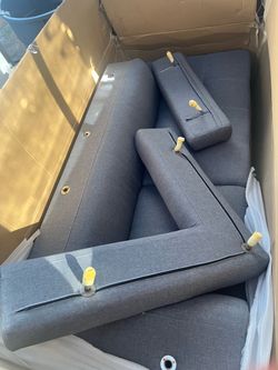 Gray Fabric Sofa Unassembled in Box