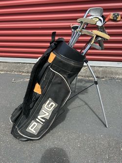 Ping Hoofer golf bag features the brand logo on the side and includes multiple compartments for clubs wit 13 different clubs in the bag