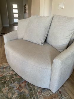 Light Gray Curved Loveseat with Pillows