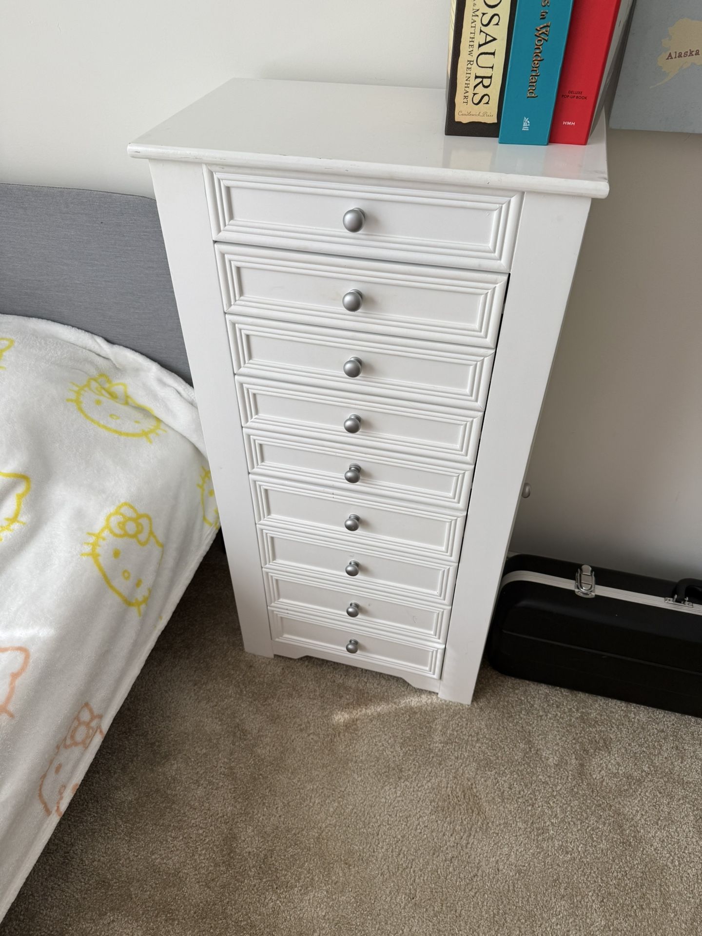 jewelry armoire with drawers, necklace hooks, and ring holders