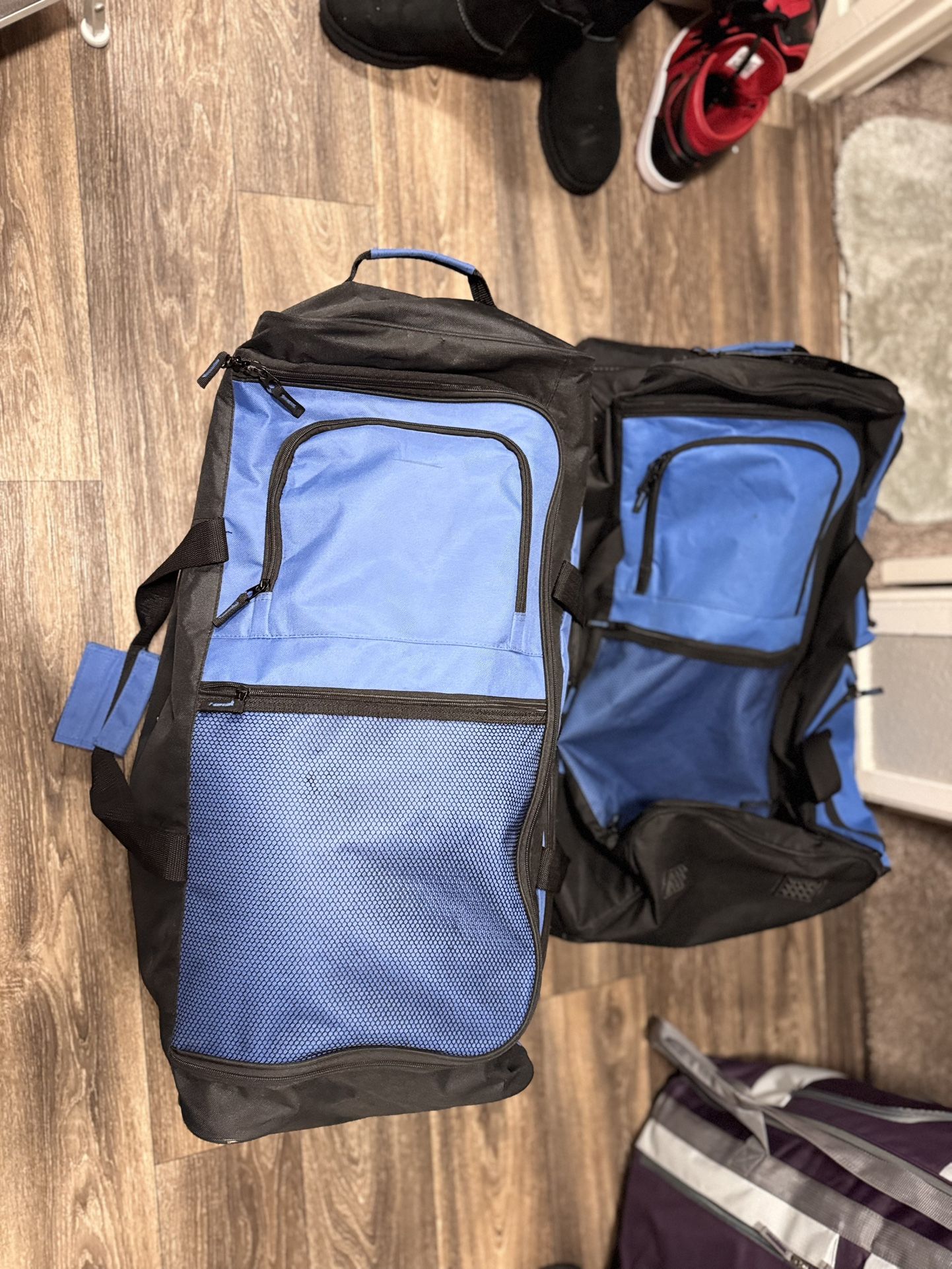 2 Large Duffle Bags With Wheels Plus Pink Carry On Bag All In Great Condition