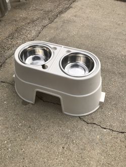 Elevated Dog food and water dish. 