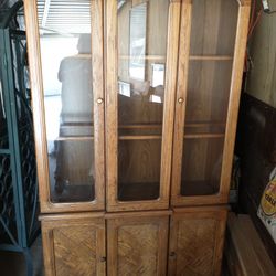 China cabinet with glass shelves and lighting