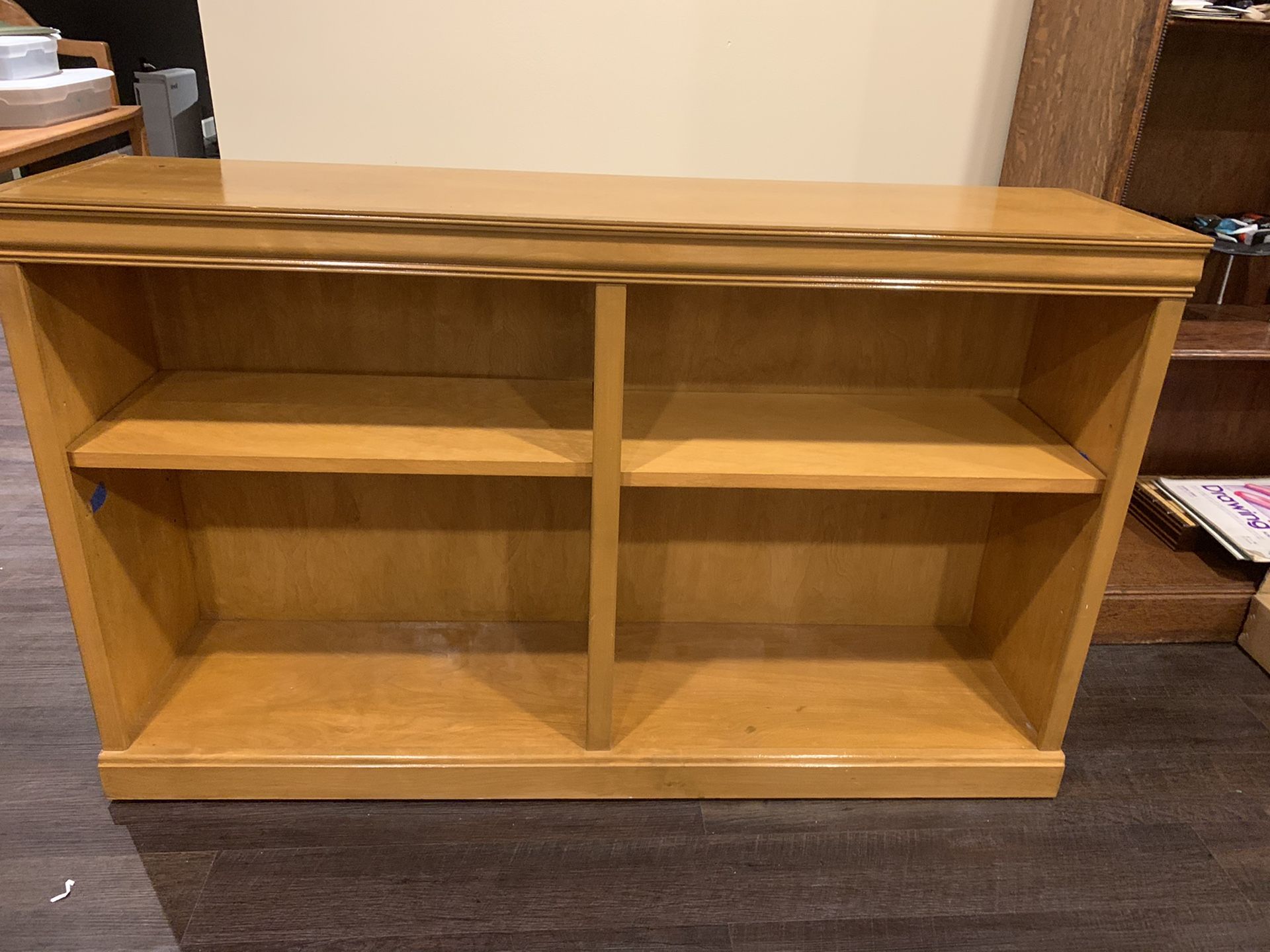 Wooden bookcase with shelves.