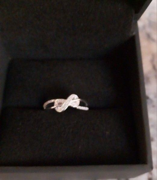 New Never Worn Have 2 Left Size 5 1/20 CT. T.W. Diamond Infinity Ring in Sterling Silver Comes W/box From Zales Pick Up Only Fall River Ma