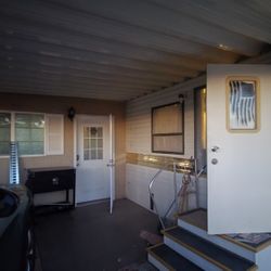1987 Cricket Park Model with 15x22 fully enclosed Arizona room. $2,500as is