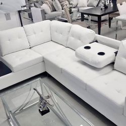 white sectional sofa with storage and cup holders