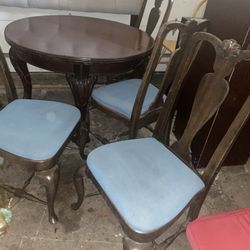 antique table and 4 chairs exelent condition 