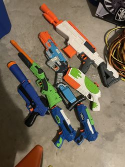 Nerf and other plastic bullet guns one water slime gun by Nerf