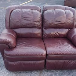 Dark burgundy dual  Real Leather recliner.
