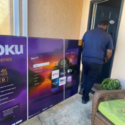 Roku tv  75 inc one yr of used  selling bc of moving